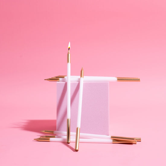 Gold White Double Dipped Tall Cake Candles Pink Background