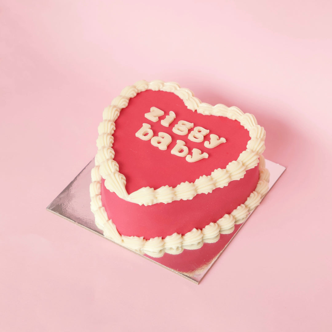 Vanilla heart shaped cake with red hearts on top – Meerut Online Cakes –  Online shop